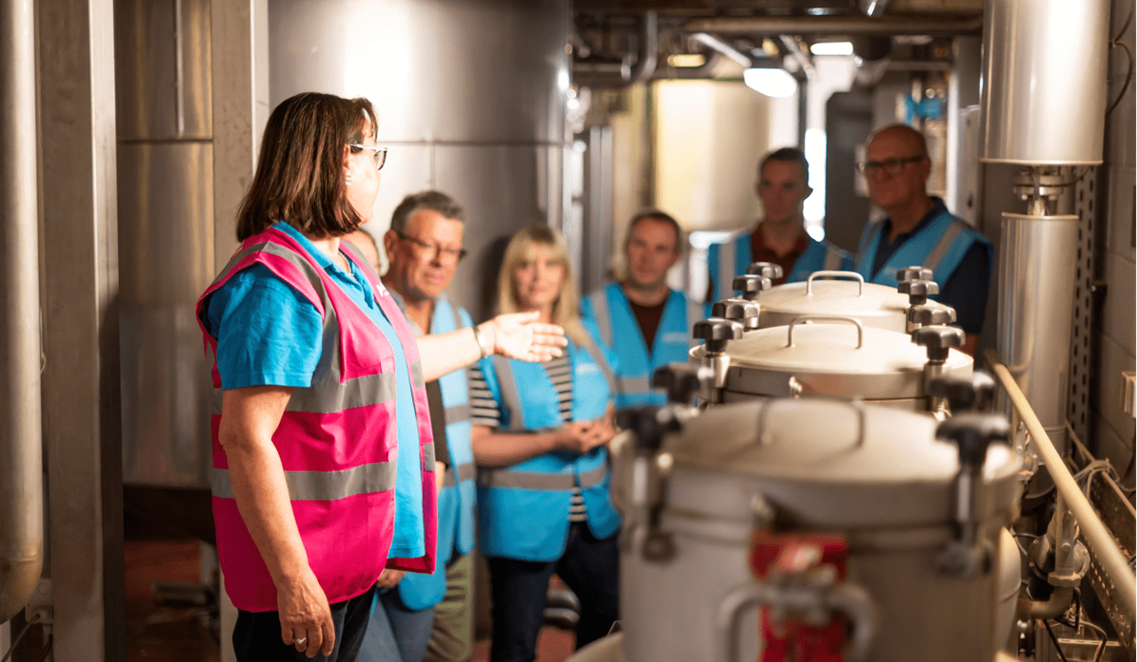 Adnams tours and tasting, guest being shown around distillery