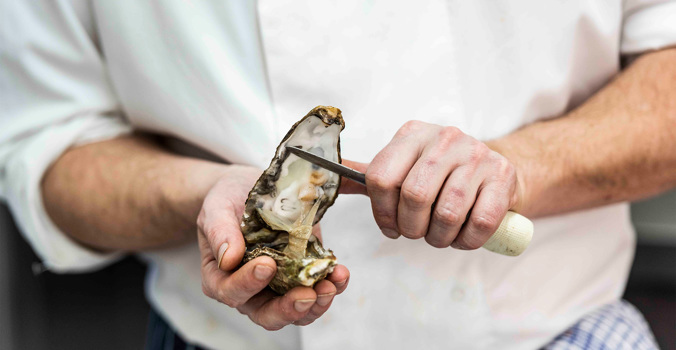 The Brudenell Hotel, Seafood & Grill Aldeburgh, chef preparing oysters