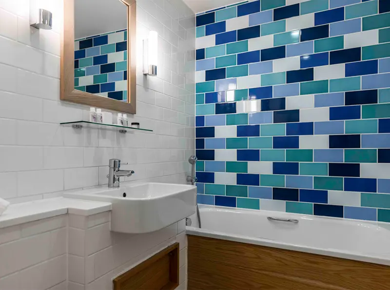 Blue and white bathroom in a Double Seaview bedroom at The Brudenell Hotel, Aldeburgh
