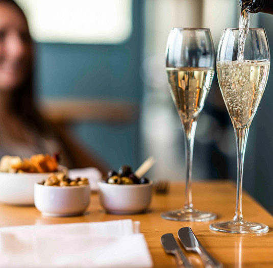 The Brudenell Hotel, Seafood & Grill restaurant, guest in restaurant, fizz being poured