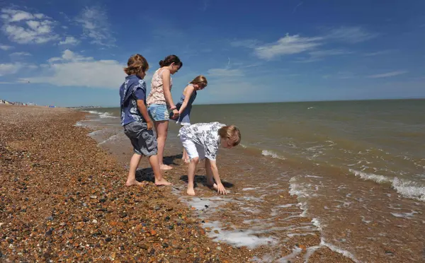 Aldeburgh beach, family playing in tide