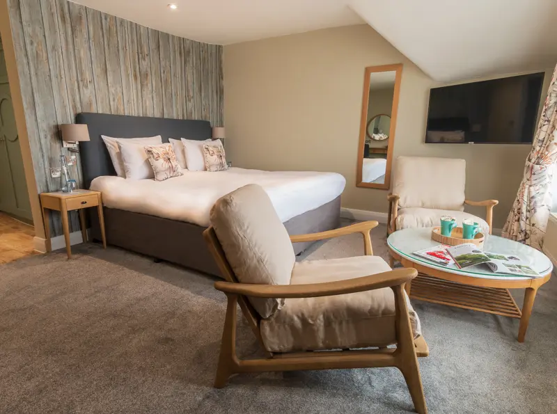 The Brudenell Aldeburgh, Superior Sea View room, bed and seating area in front of window